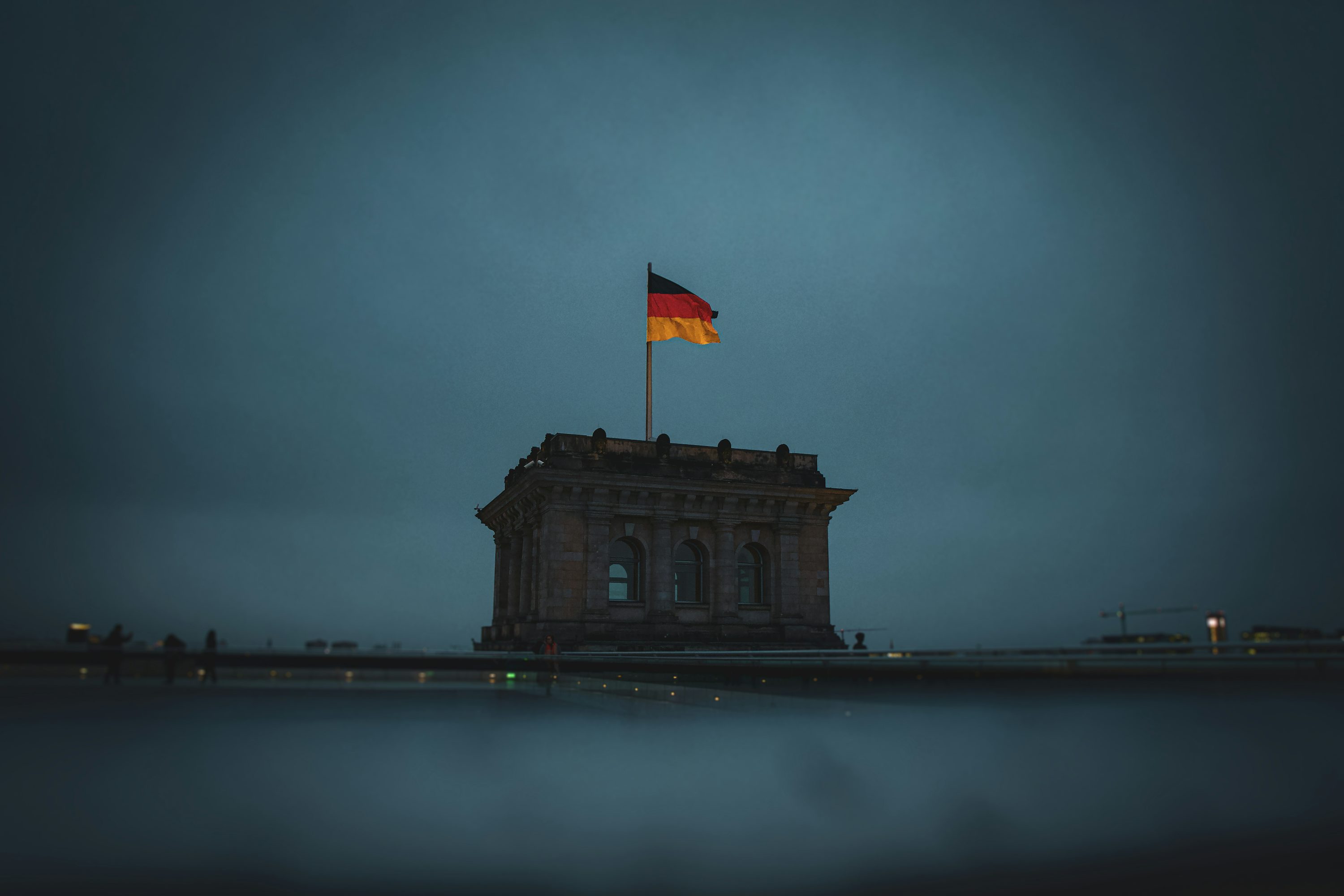 German Flag Flying High over Berlin Reichstag Building - Destination Germany